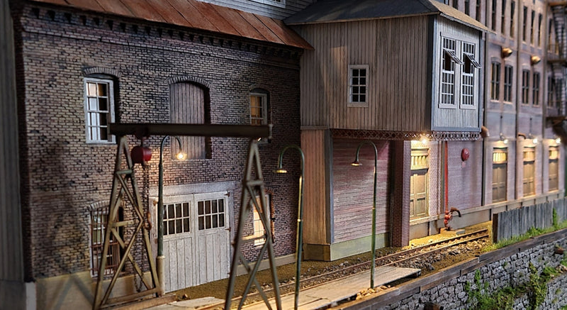 HO Industrial building lamps and Narrow Gauge gooseneck lamps on a model train diorama 